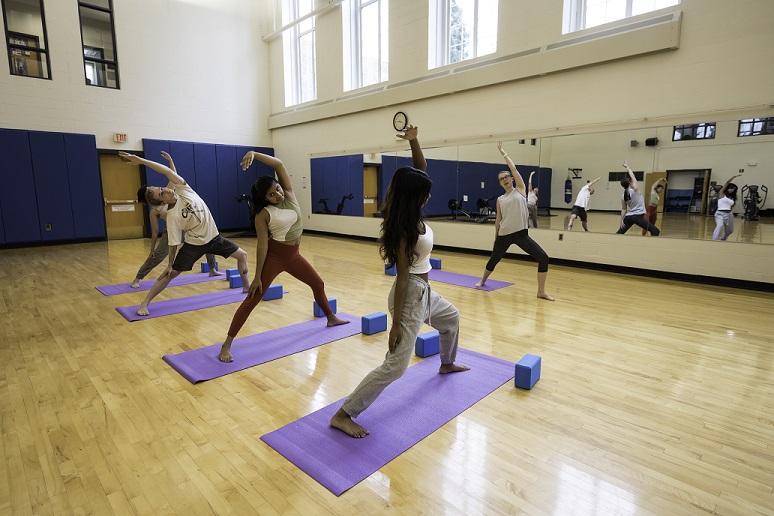 Students practicing yoga in the Athletic Center